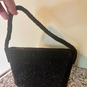 Vintage black beaded cocktail purse .